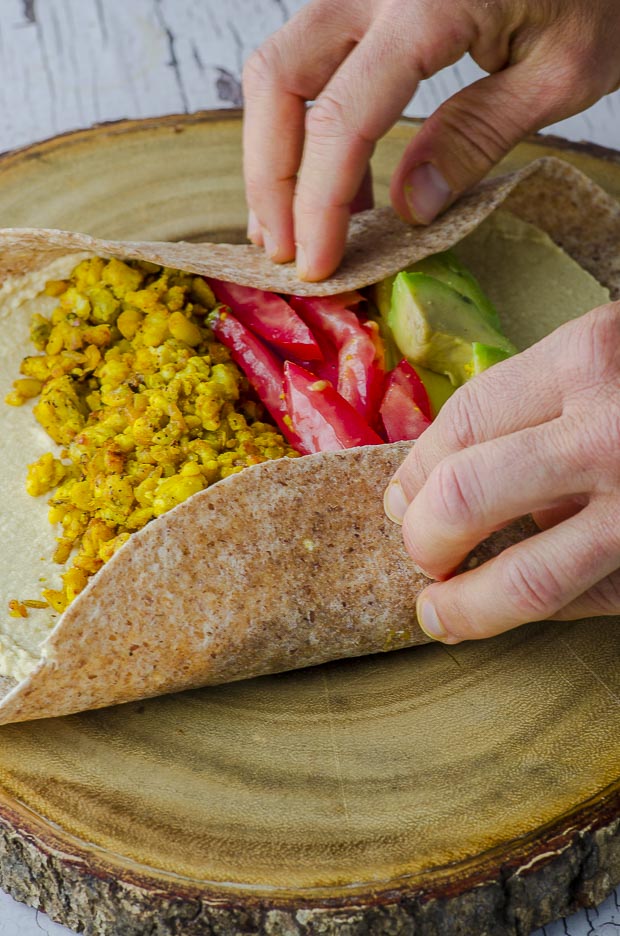 Wrapping a vegan tempeh breakfast burrito