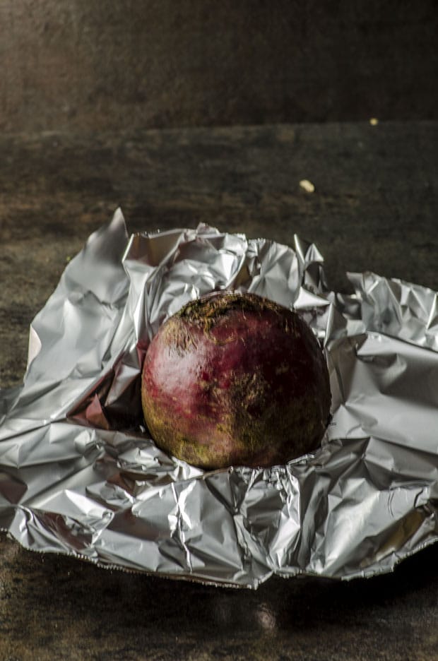 A beet ready to be wrapped in aluminum foil
