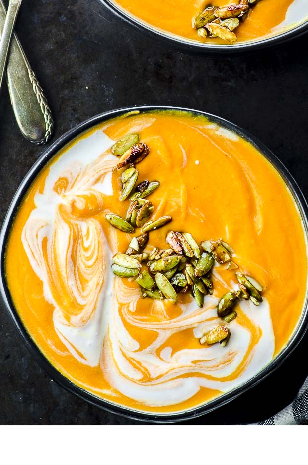 A close-up of a bowl of coconut carrot ginger soup
