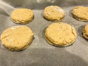 Sweet potato vegan biscuits in a baking sheet ready to be baked