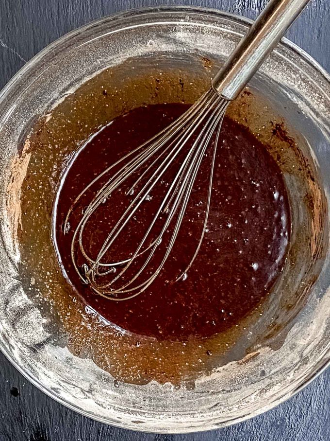Whisking egg or flax egg, coconut oil , sugar, vanilla and cocoa powder in a bowl