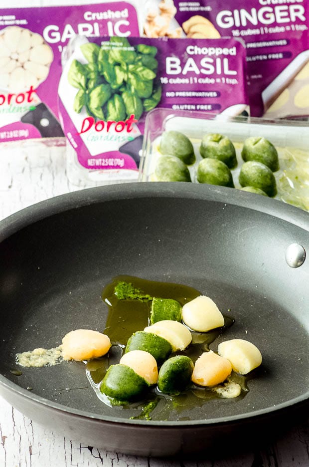Dorot frozen herbs, garlic and ginger in a skillet with oii
