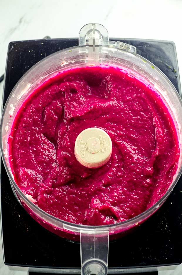 cauliflower beet dip in the bowl of a food processor
