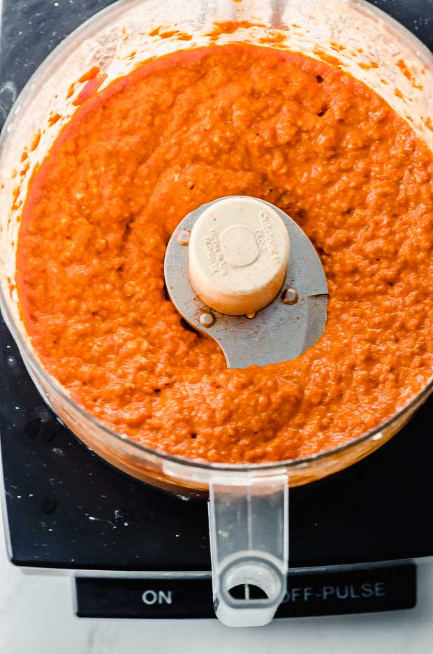 romesco sauce in the bowl of a food processor 