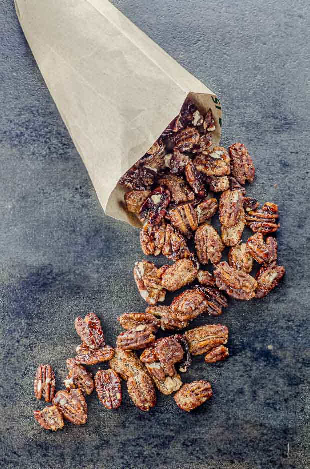 Candied pecan coming out of a paper cone