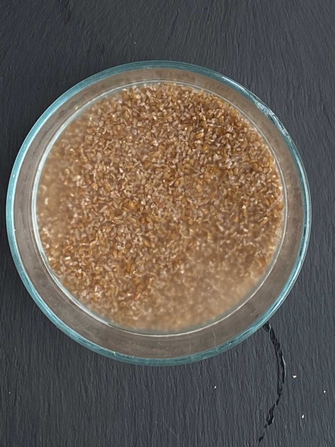 Bulgur wheat in a bowl soaking in water