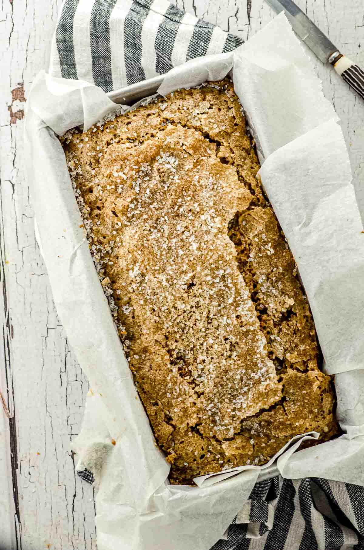 Overhead view of a whole loaf of bake zucchini bread in its loaf pan.