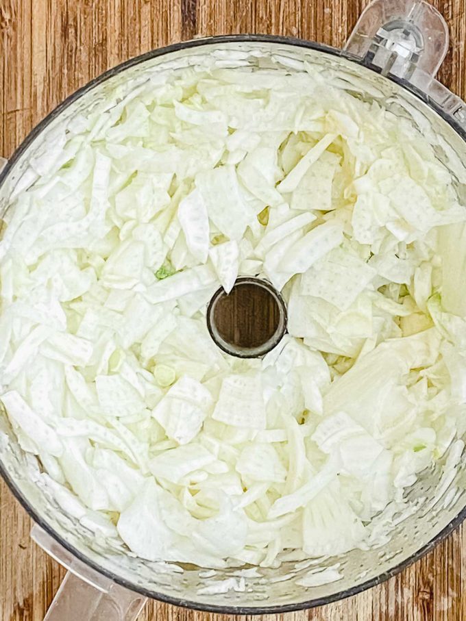Sliced fennel in a food processor bowl
