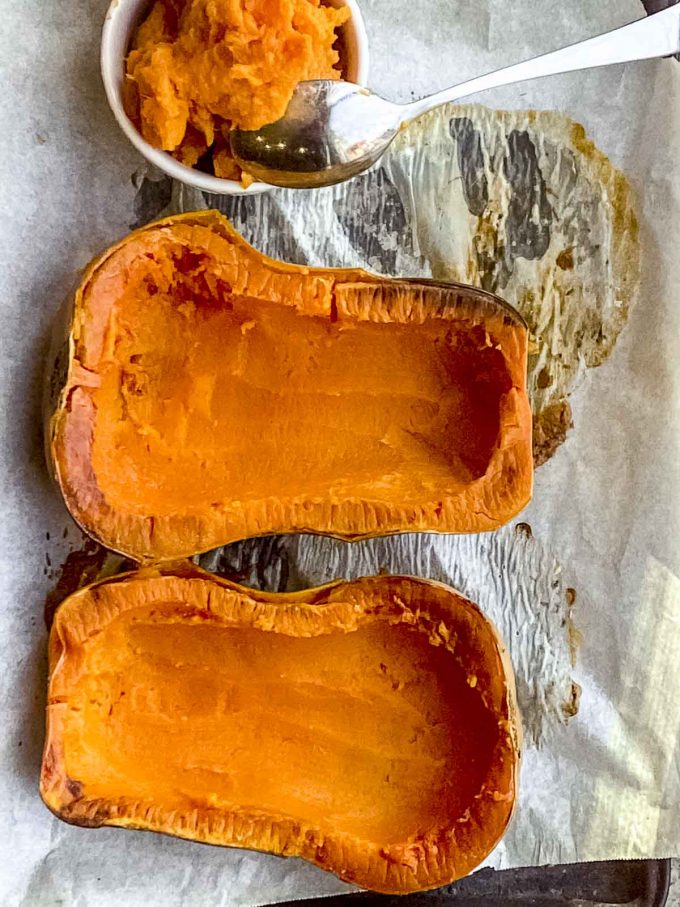 Two roasted butternut squash halves cut side up