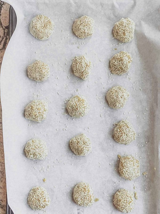 tahini cookie dough balls rolled in sesame seeds