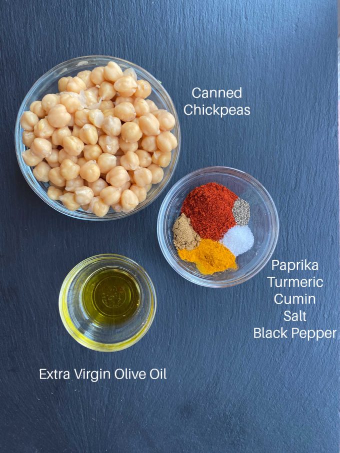 Ingredients for spiced chickpeas labeled - canned chickpeas, spices, olive oil