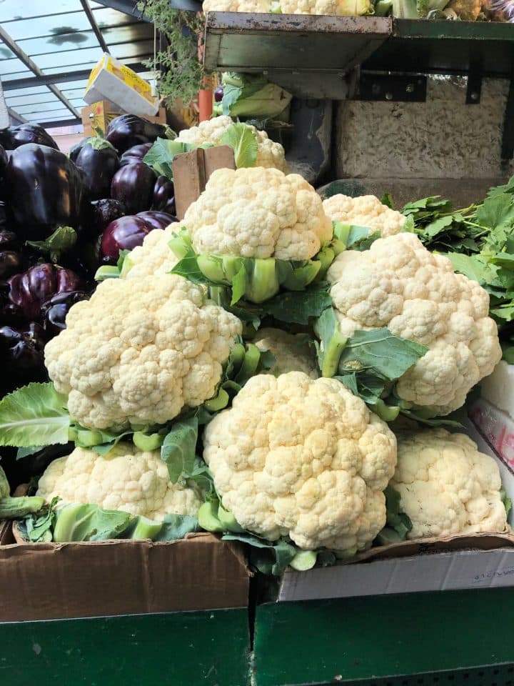 Cauliflowers piled on a market stand