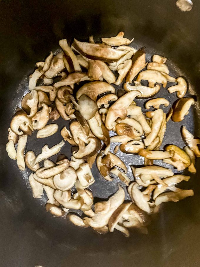 Shiitake mushroom cooking in a pan