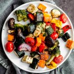 Oven roasted vegetables on a white plate