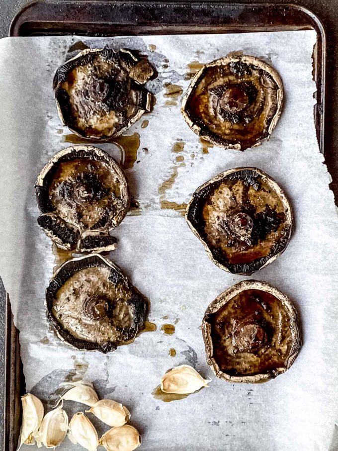 Roasted portebello mushrooms on a baking sheet