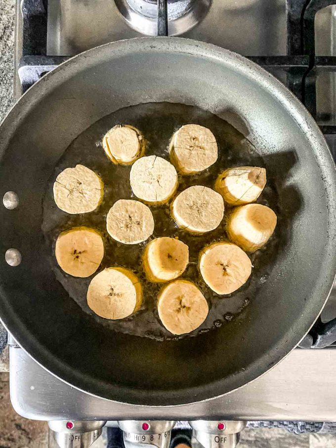 Cooking platntain slices on a skille