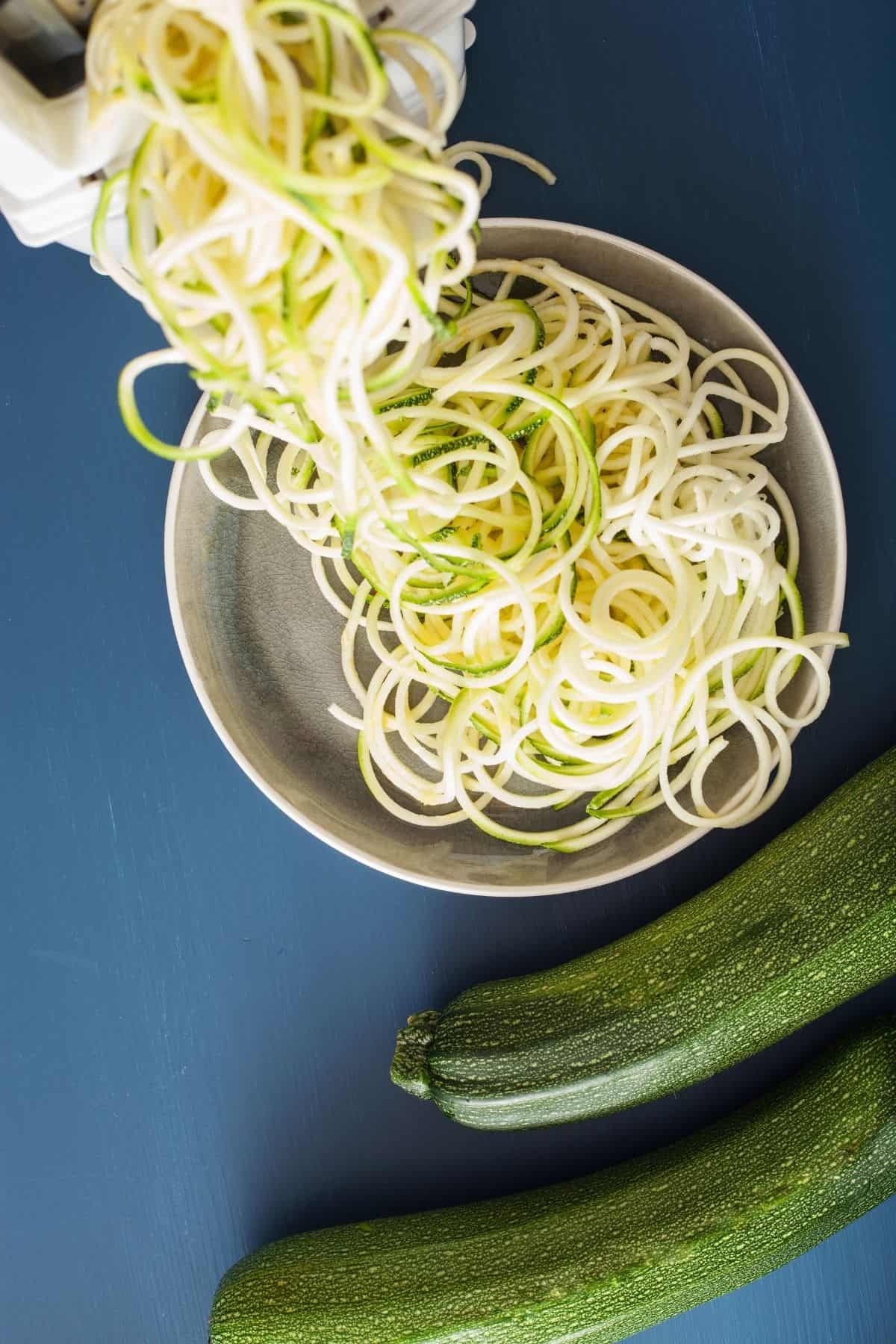 Over head view of Making zucchini noodle with a spiralizer