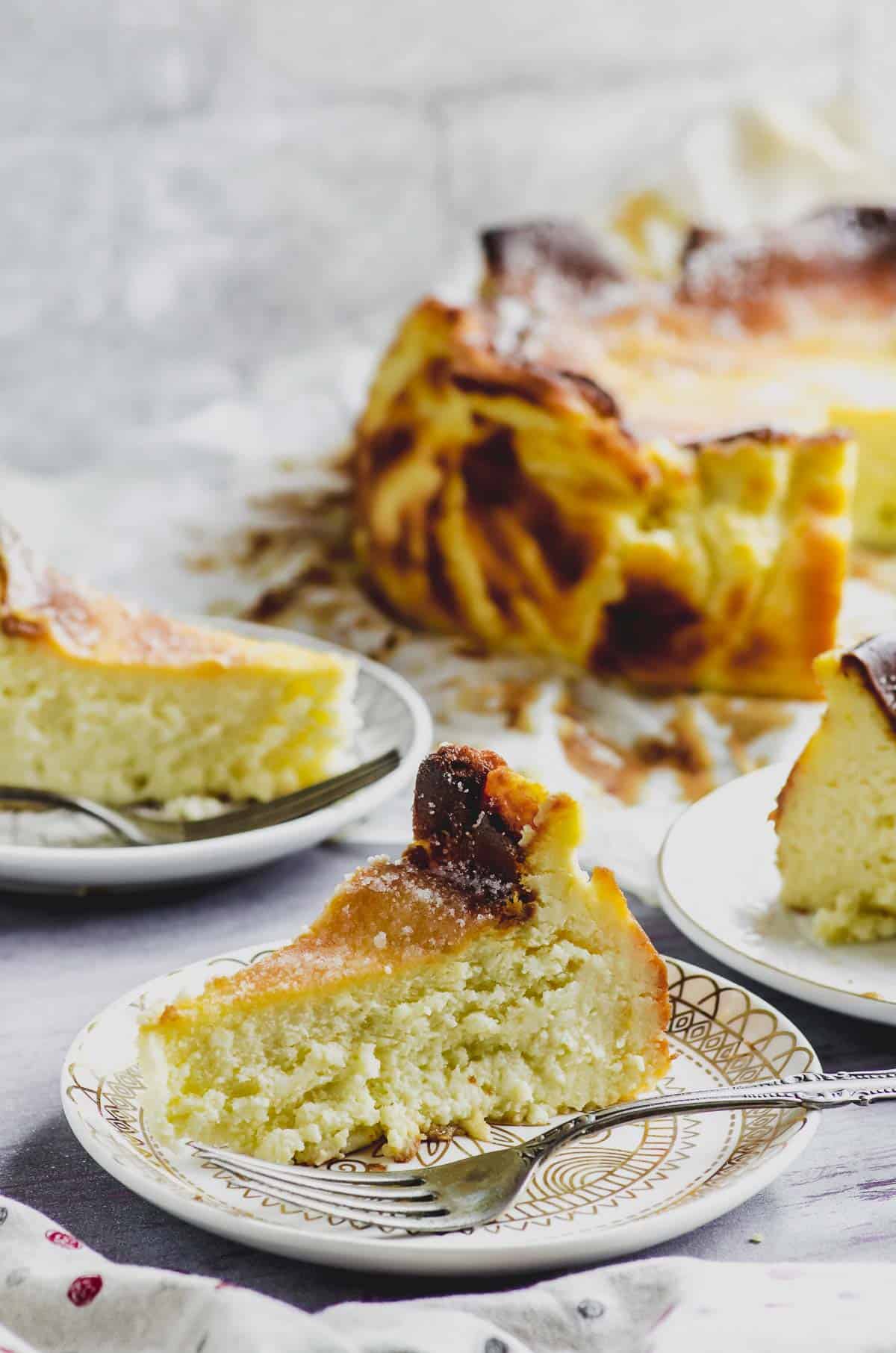 Close up side View of a slice of Basque cheesecake on a plate