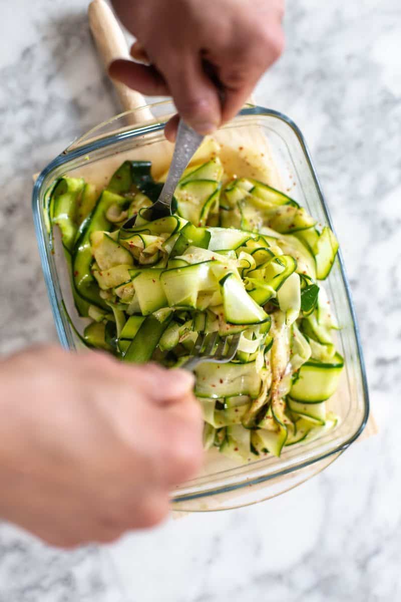 Mixing the zucchini salad