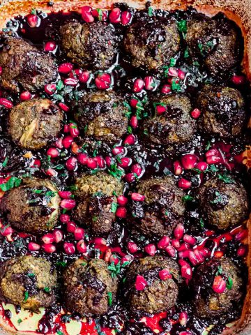 close up view of eggplant meatballs with pomegranate molasses