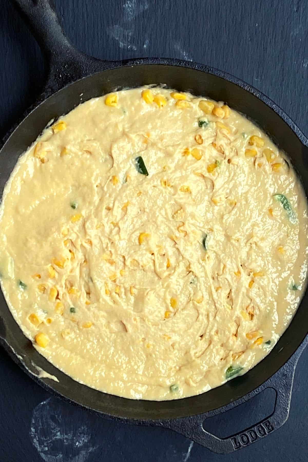 Overhead view of Jalapeno cornbread mixture in a cast iron skillet