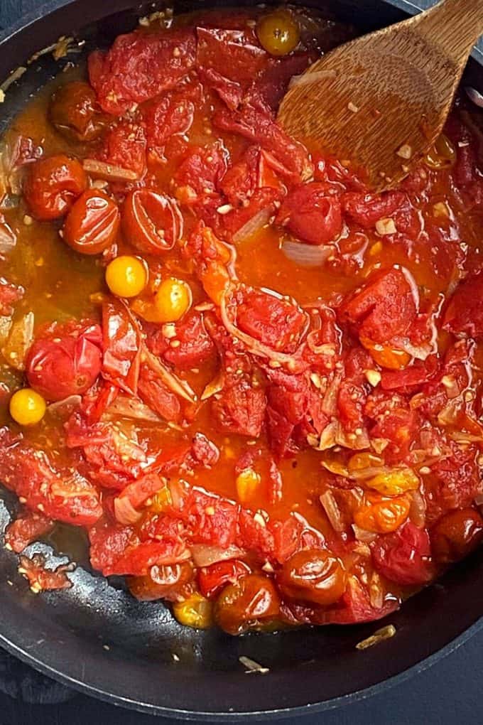 fresh tomatoes cooking in a pot
