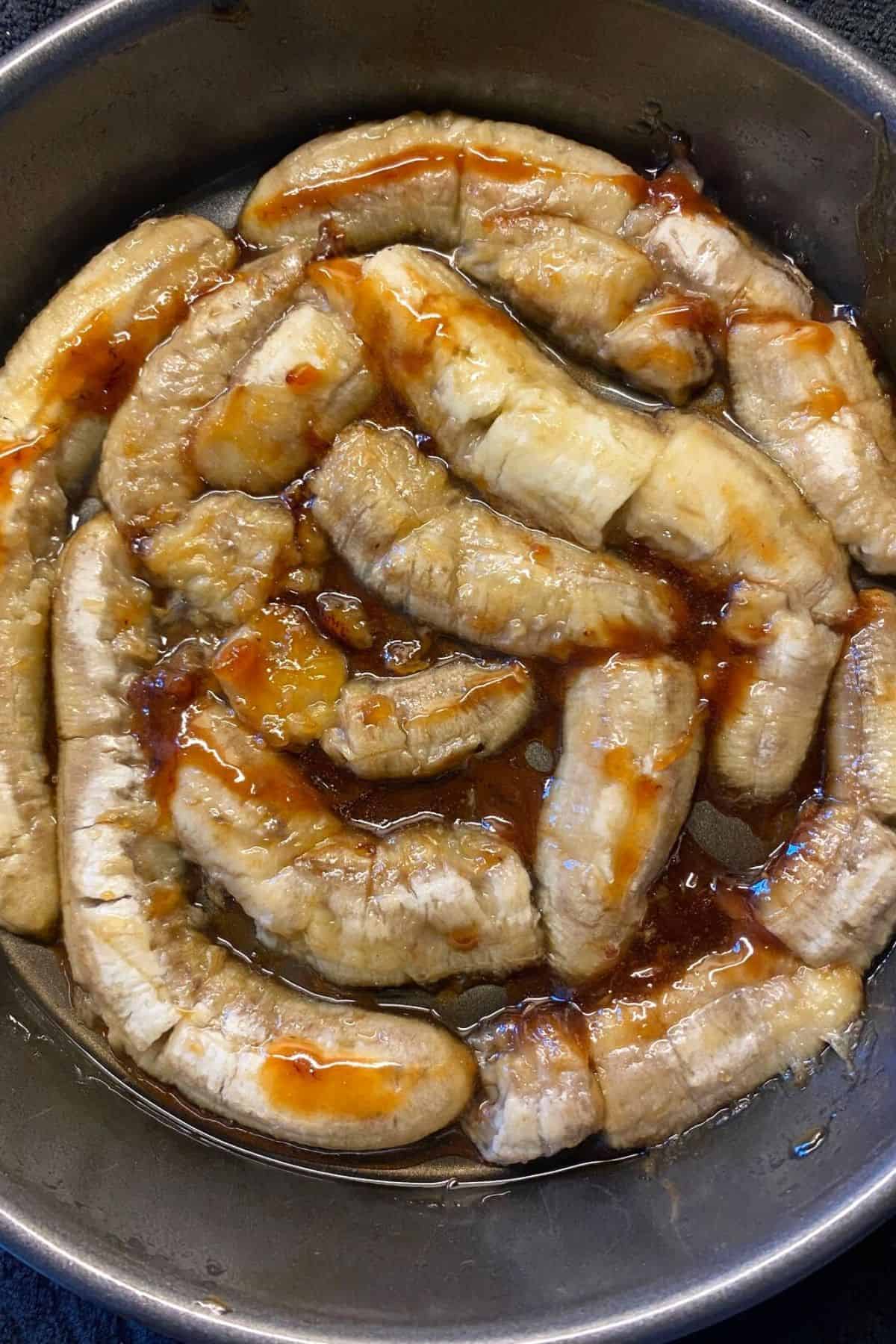 An overhead view of caramelized bananas with agave drizzle