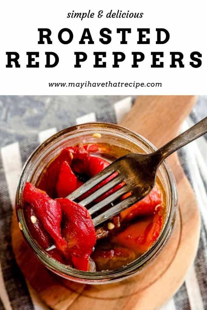 An overhead view of a jar of roasted red peppers with a fork with a pepper on it