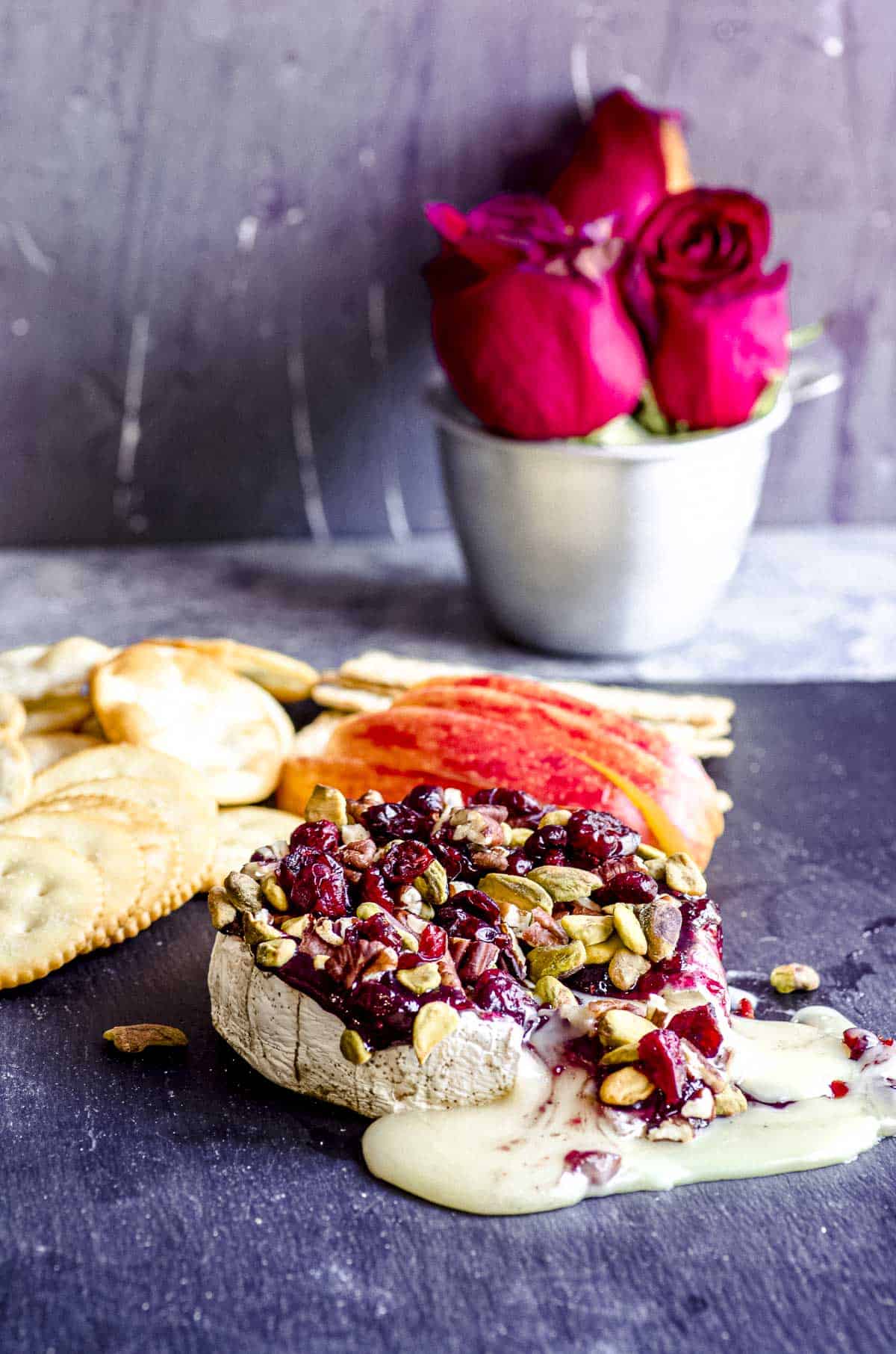 Baked brie topped with cranberries and pecans
