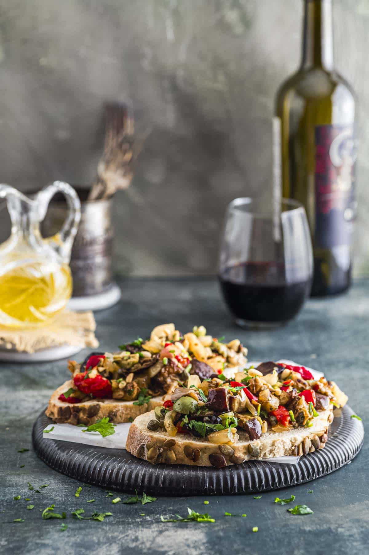 Side view of two slices of bread with eggplant caponata 