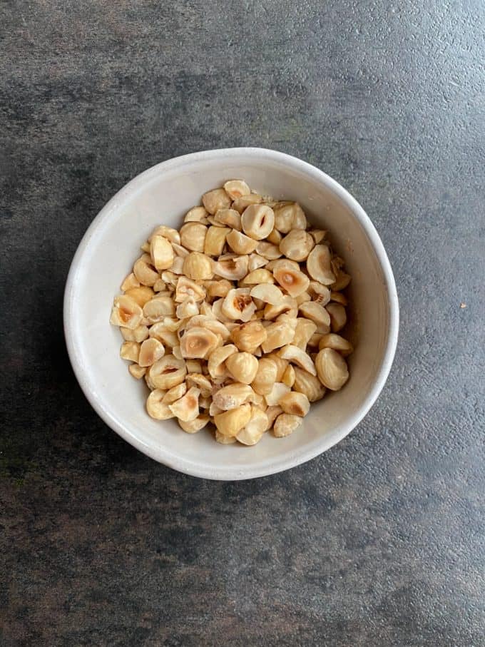 a bowl of toasted hazelnuts