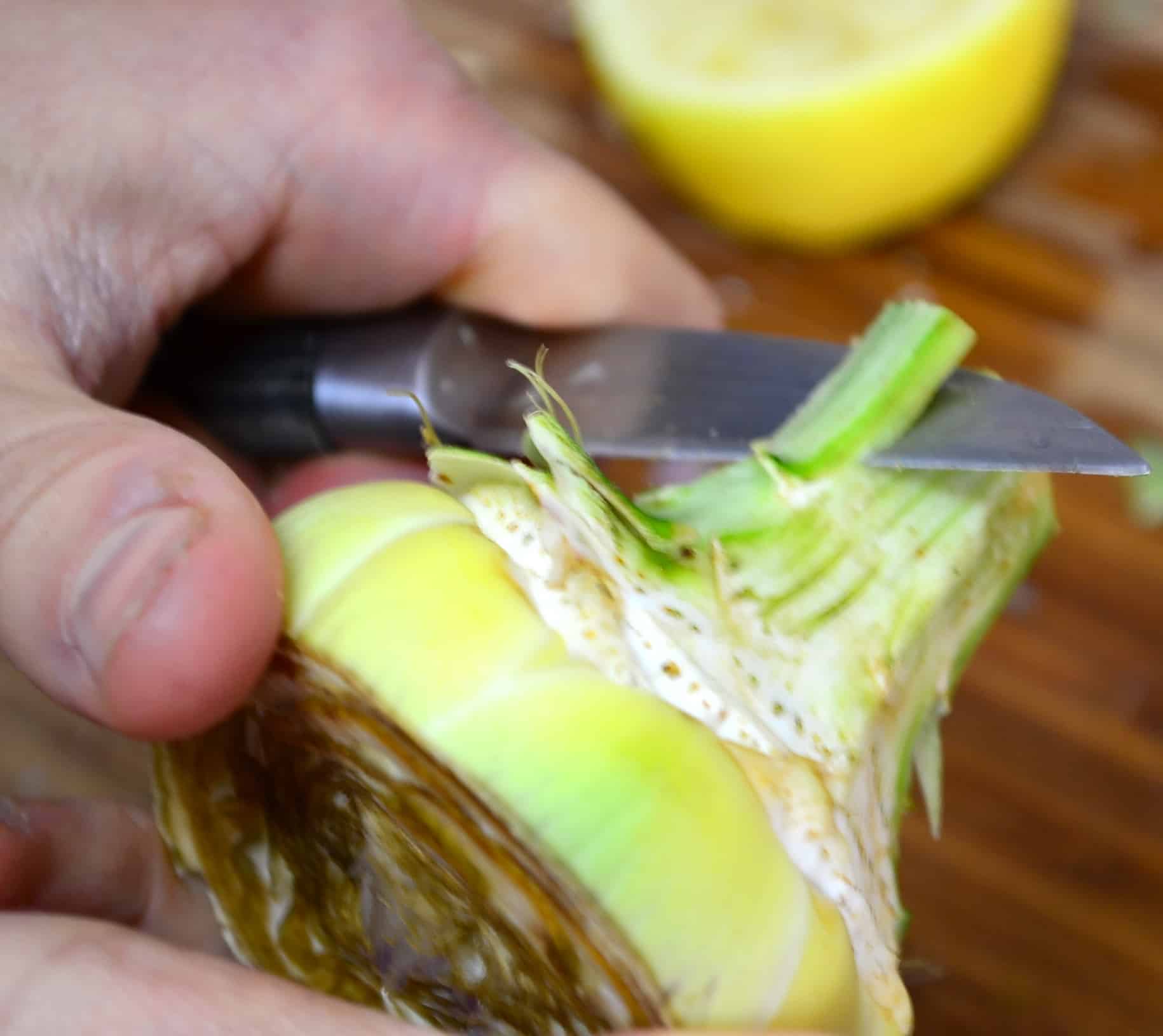 peeling a fresh artichoke