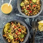 overhead view of two bowls of mediterranean quinoa salad