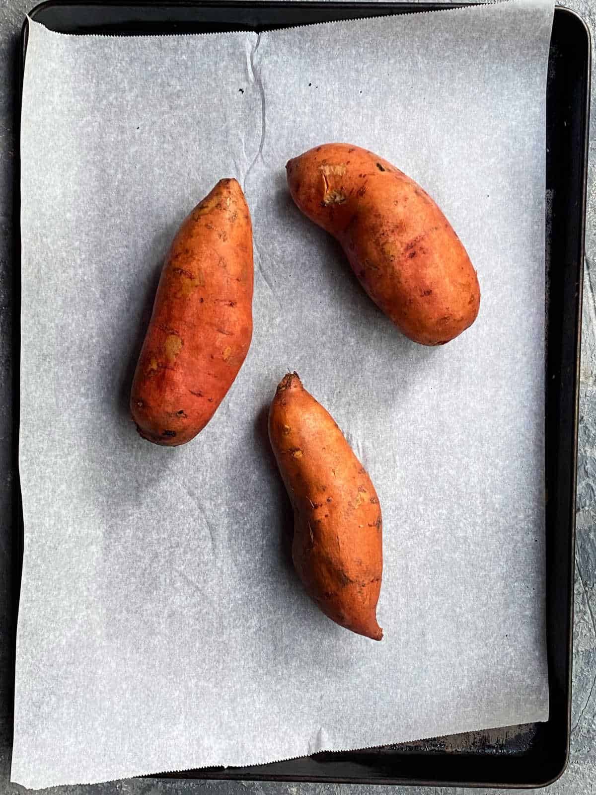 sweet potatoes on a baking sheet