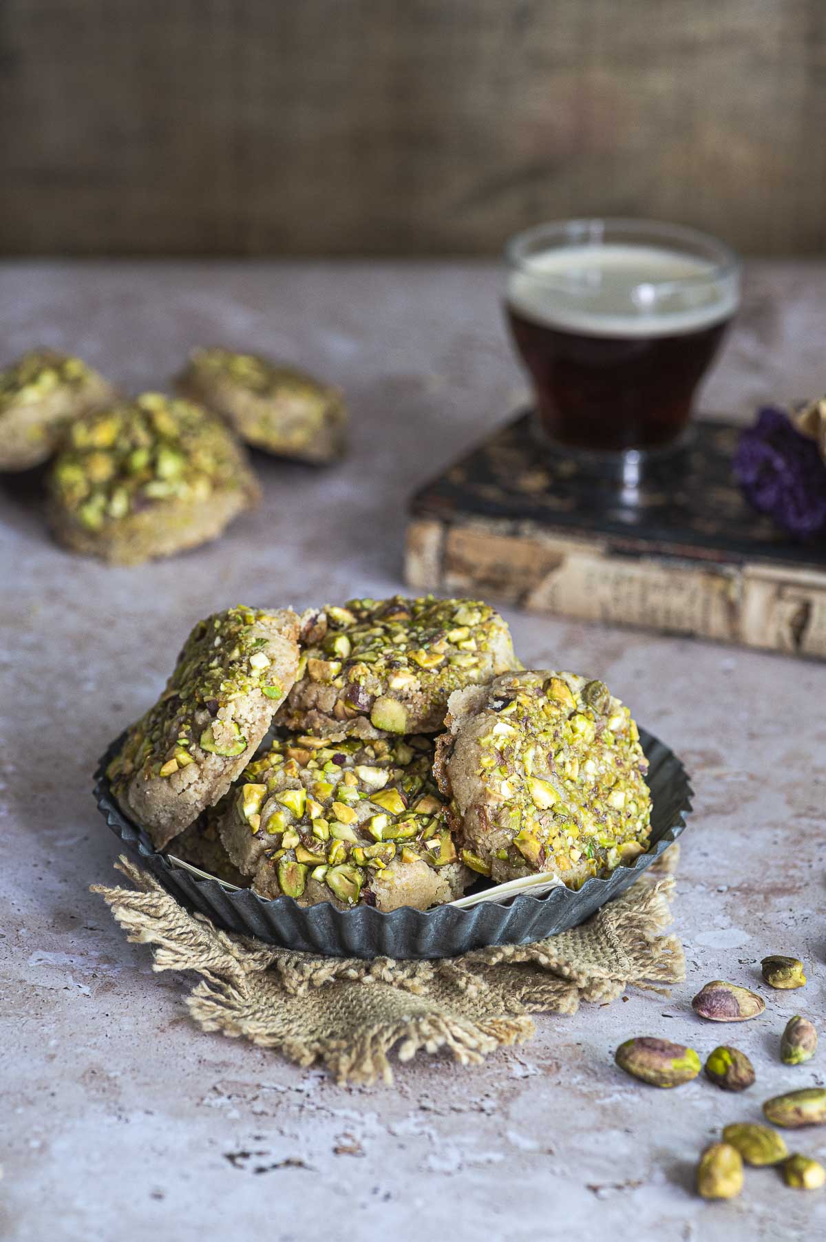 Side view of plate filled with pistachio cookies