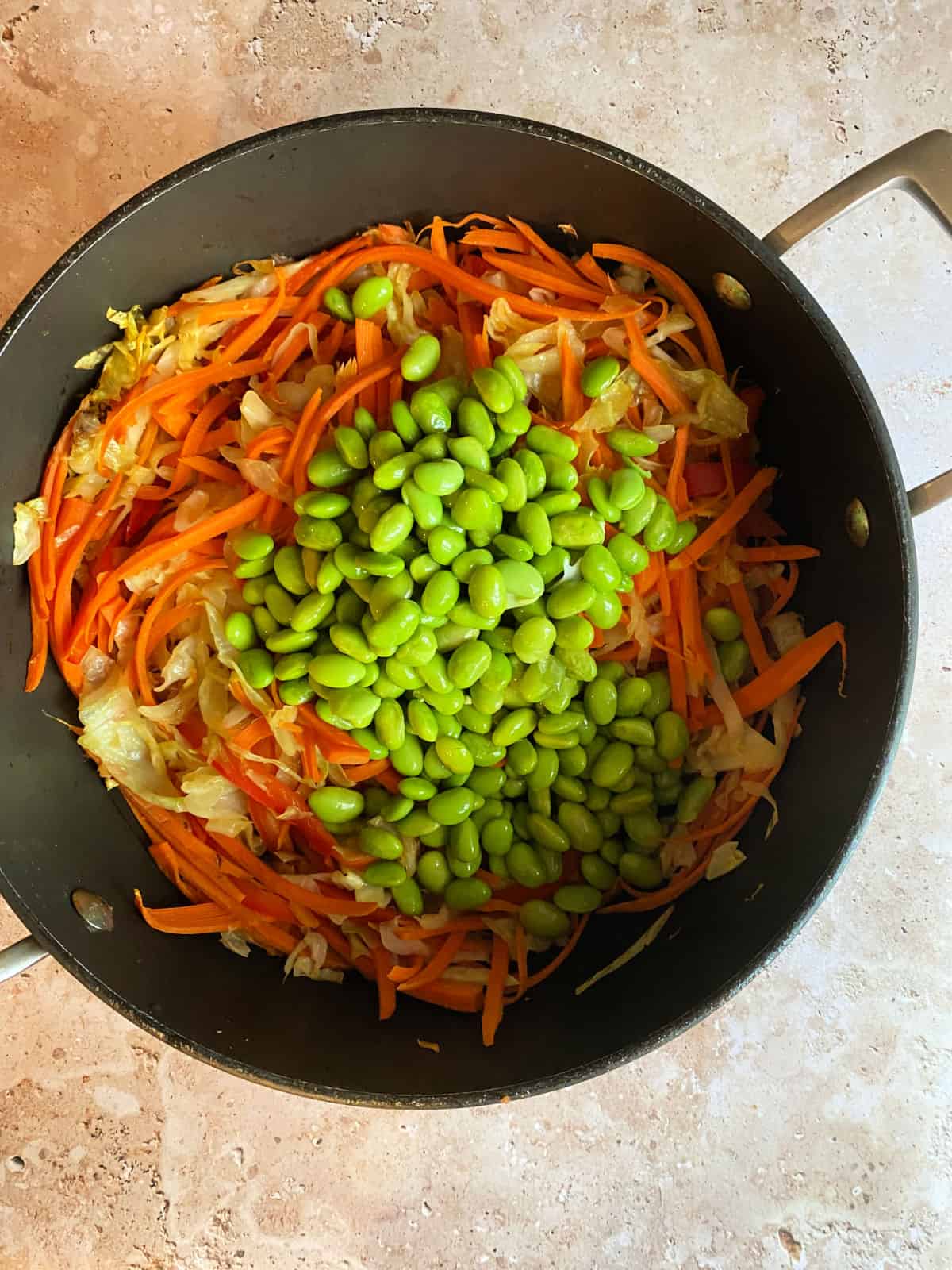 Ingredients of cabbage stir fry in a pan