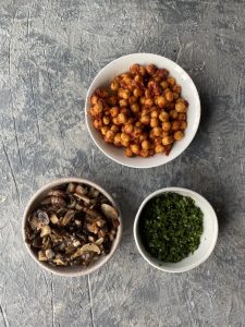 sauté mushrooms, harissa chickpeas and spinach in 3 bowls