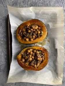 Roasted kabocha squash reciped filled with harissa chickpeas, mushroom and spinach