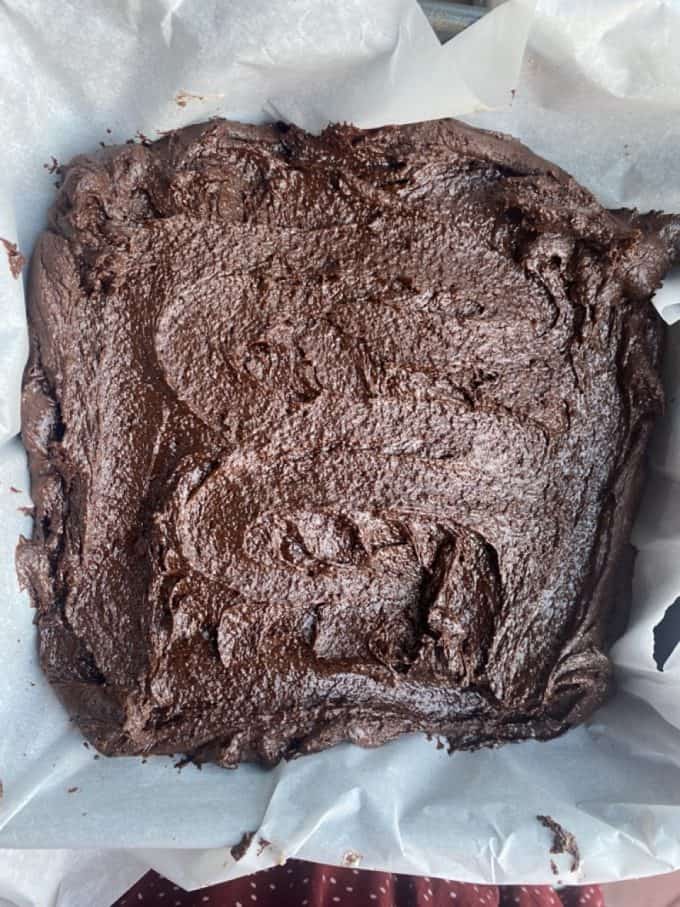 Brownie batter in a baking pan
