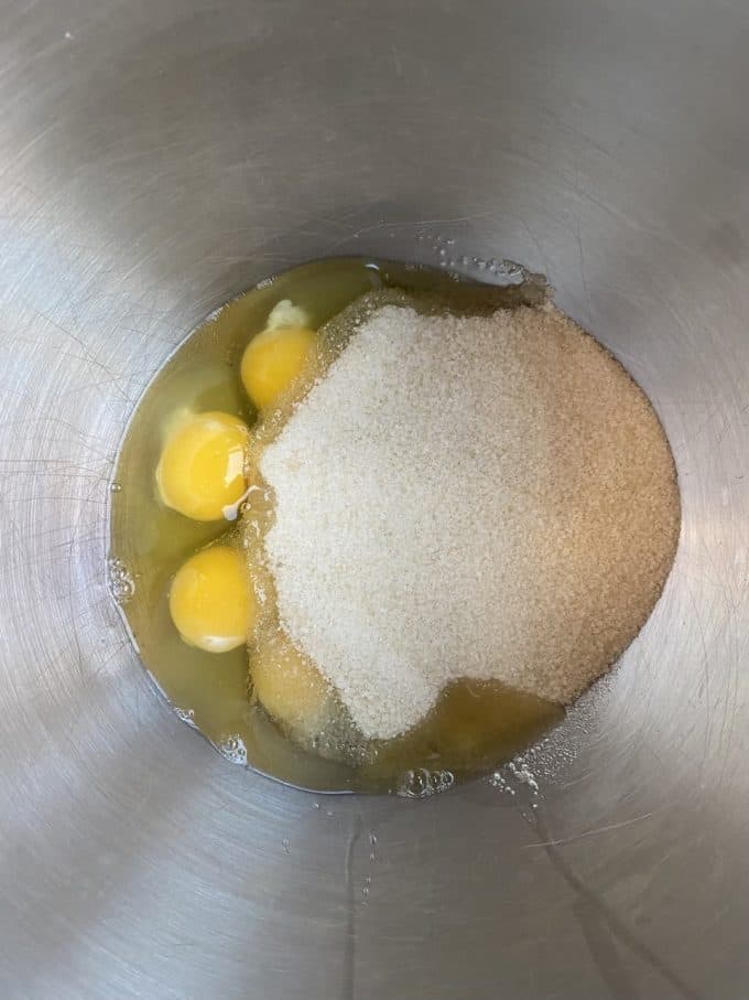 Eggs and sugar in a mixer bowl

