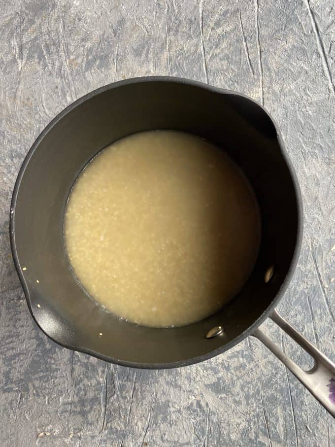 cooked quinoa in a pot with water
