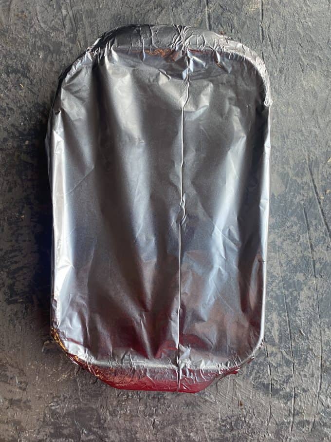 a baking pan covered with aluminum foil

