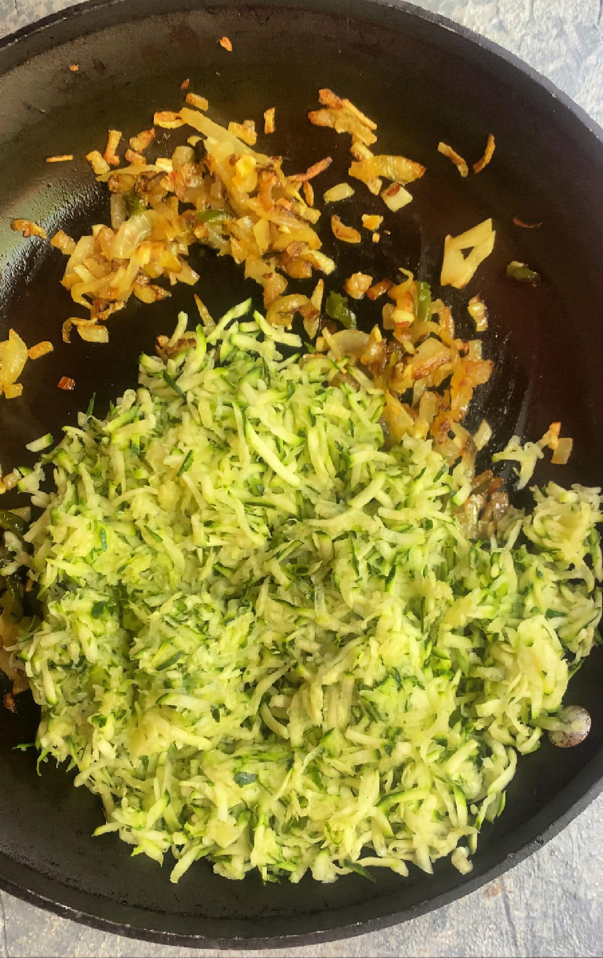 Adding zucchini to the onions and jalapeño