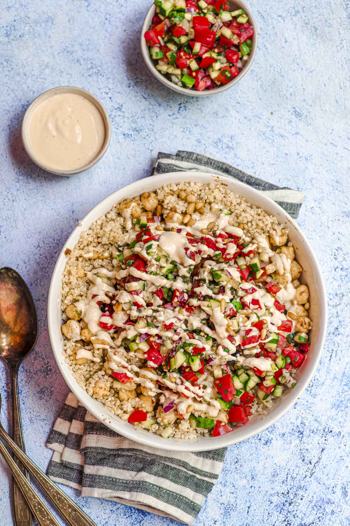 Israeli quinoa bowl with a drizzle of tahini 
