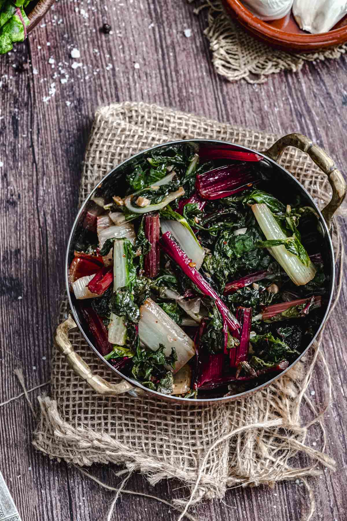Close up view of a bowl of sauteed swiss chard