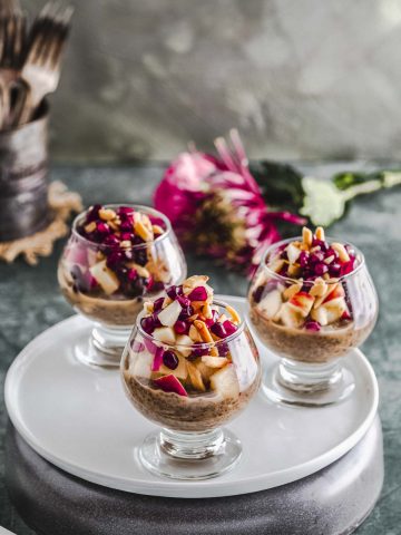 The glass cups with apple pie chia seed pudding