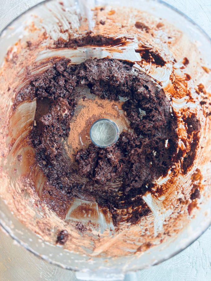 energy ball ingredients in a food processor after being ground to a paste