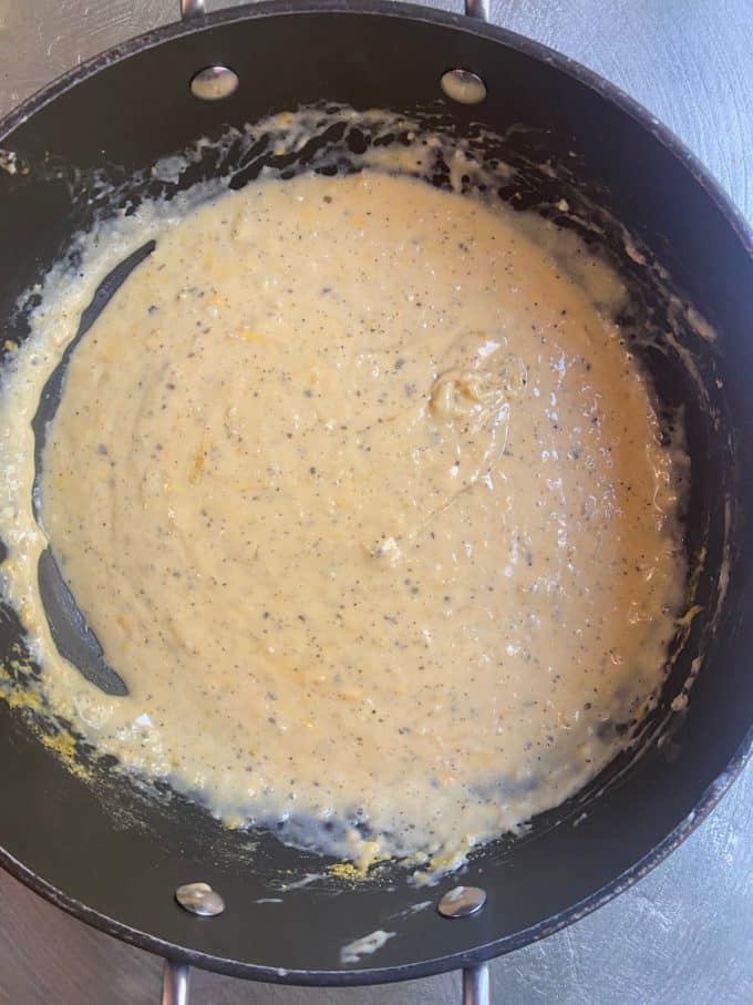 overehead shot of a nonstick skillet with a vegan cheese sauce
