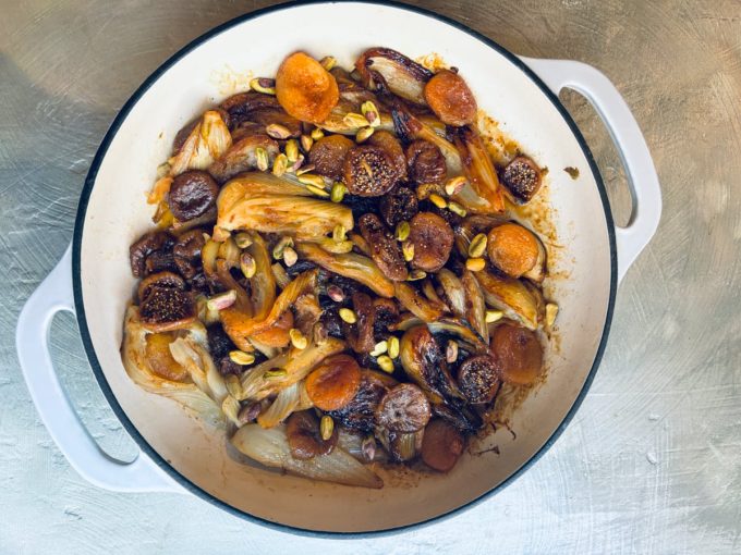 overhead shot finished dish Braised Fennel with apricots and figs in a saucepan
