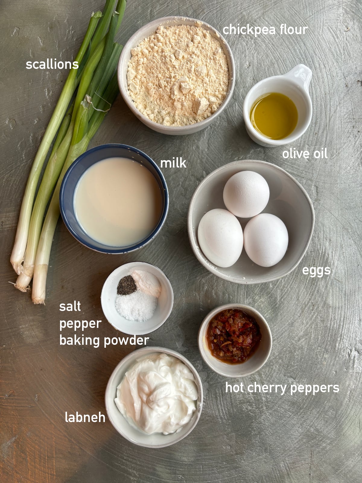 An overhead shot of the ingredients needed to make Savory Chickpea Flour and Scallion Pancakes. 